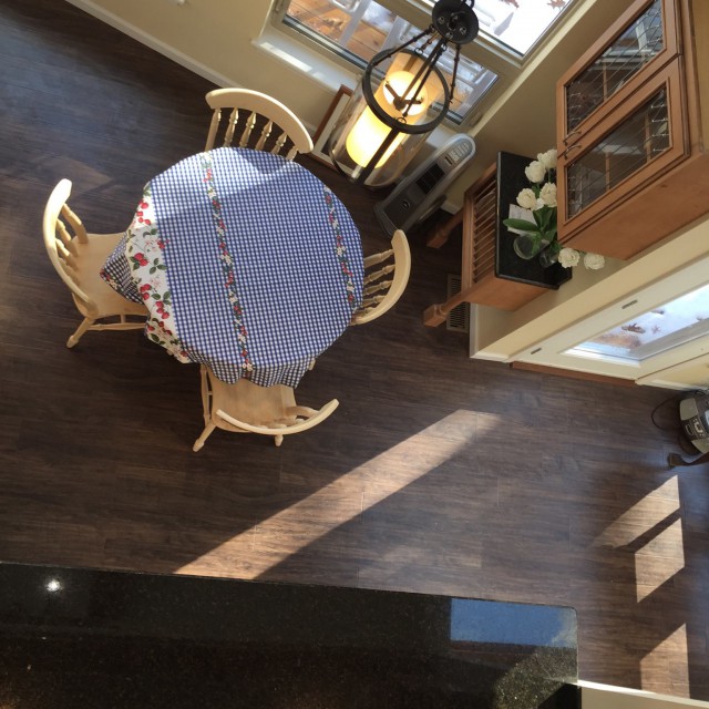 Aerial View of New Flooring and Stylish Table & Cabinetry Aerial View of New Flooring and Stylish Table & Cabinetry